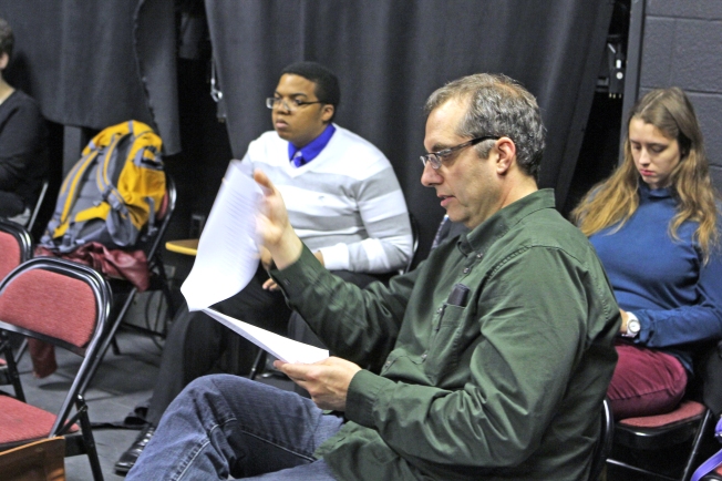 Robert Neal looks over the Queen Anne monologue from "Richard III" during the Speech for the Stage course that he teaches at UIndy. (James Figy)